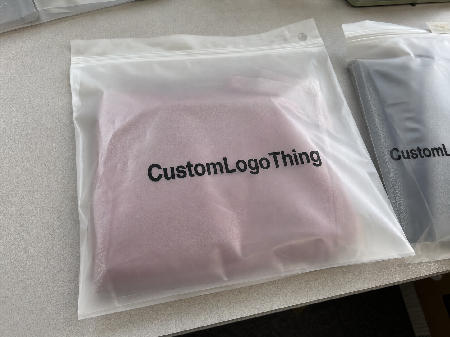 custom frosted zipper bags for jewelry packing teams - CustomLogoThing product photo