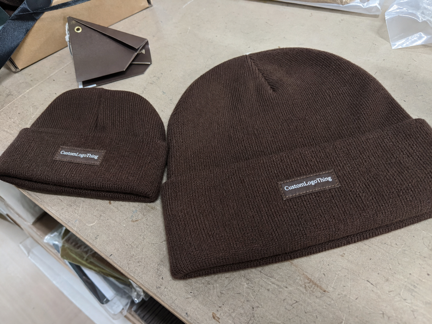 Chocolate woven label beanies unit cost review for buyers