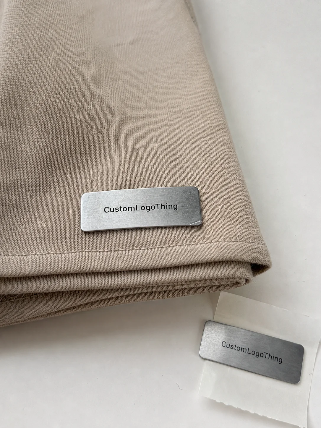 What custom metal adhesive labels really are for apparel - CustomLogoThing packaging example